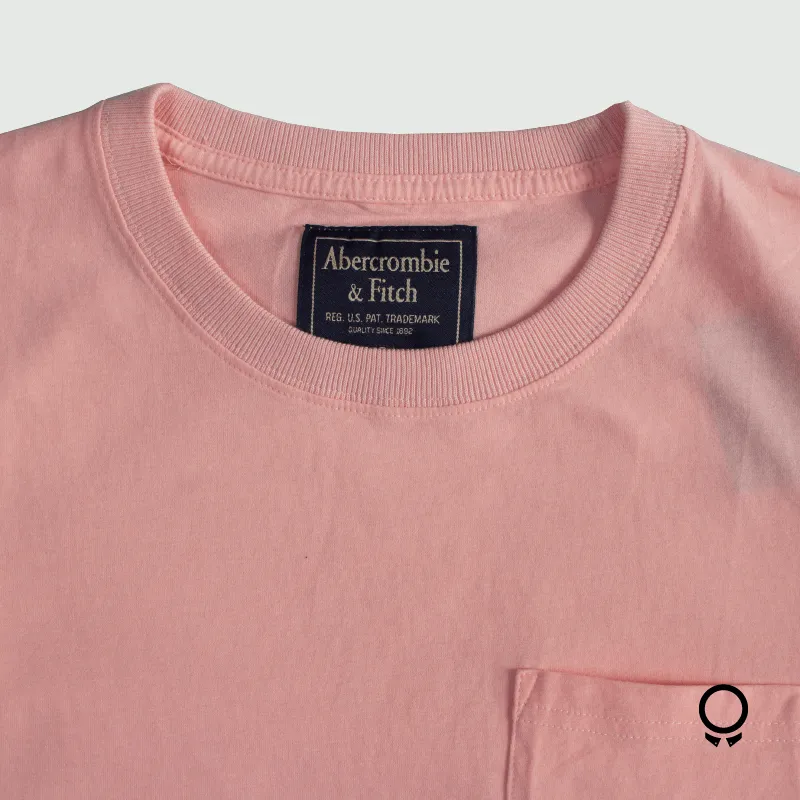 REMERA ABERCROMBIE REDONDO CON BOLSILLO ROSADO