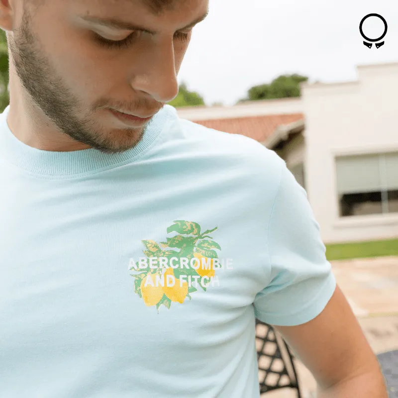 REMERA ABERCROMBIE TURQUESA ESTAMPA LIMONES