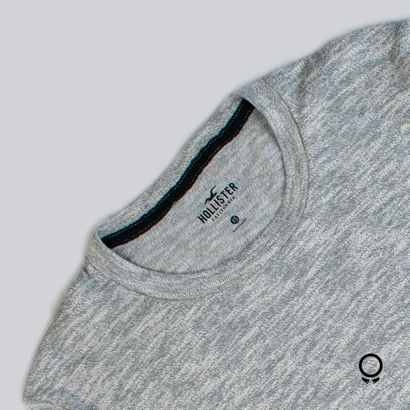 SWEATER HOLLISTER CURVA CUELLO REDONDO  GRIS DEGRADE