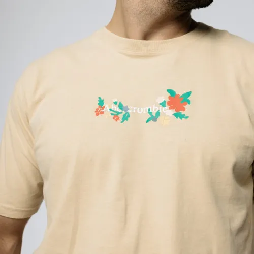 REMERA ABERCROMBIE OVERSIZE FLOWERS BEIGE